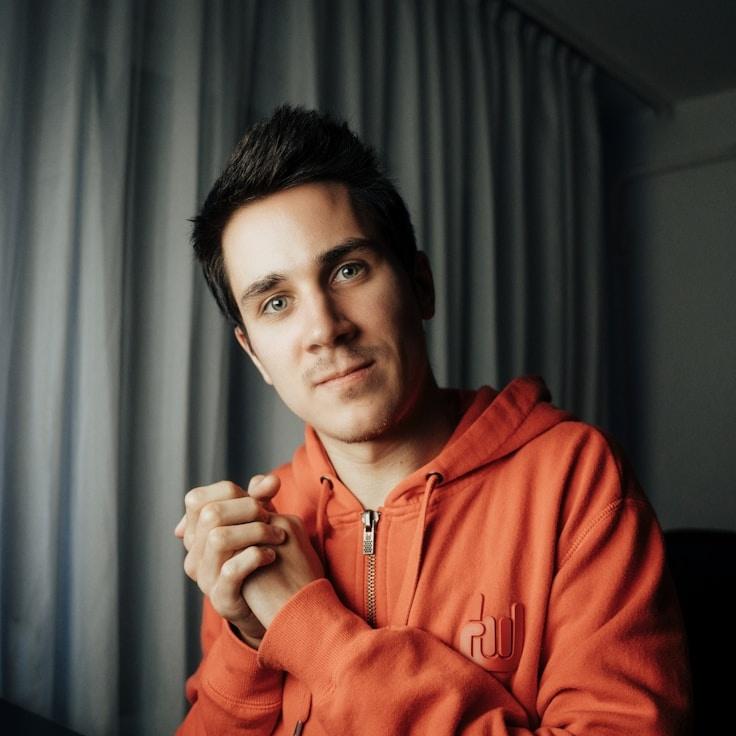 Alex Rivera, Lead Design Curator at Crate Kernel Matrix, reviewing corporate floral arrangements